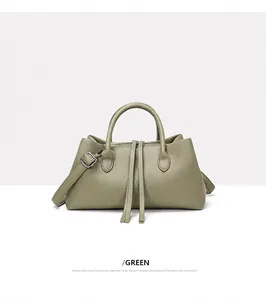 Elegant olive green pebble leather tote bag with top handles and shoulder strap.