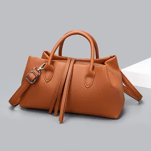 Elegant caramel brown pebbled leather tote bag for women featuring stylish long tassels