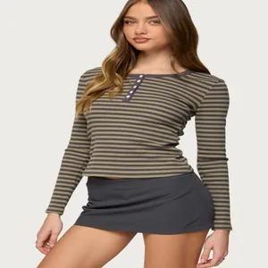 Close-up of a brown striped long-sleeve T-shirt with a five-button round neck design.