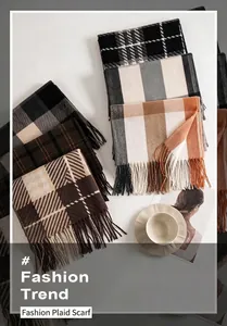 Detailed view of multiple plaid scarves with soft fringe edges in various colors