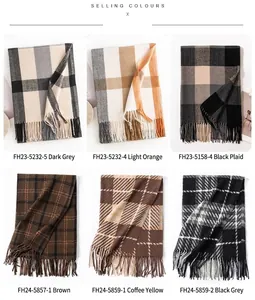 Selection of checkered scarves in various colors and plaid patterns with tassels.