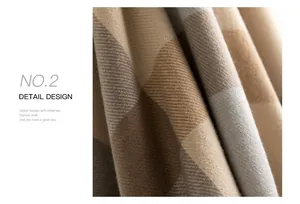 Macro view of soft plaid imitation cashmere scarf showing twill weave texture.