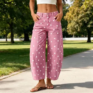 Pink polka dot barrel leg jeans with a relaxed curved fit for stylish casual wear