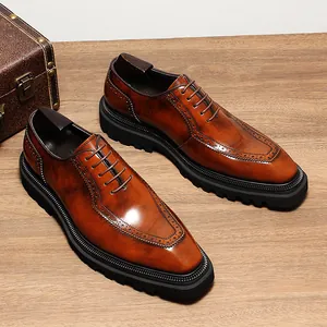 Detail shot of premium brown leather Oxford shoes with thick lug soles and brogue wingtip design.