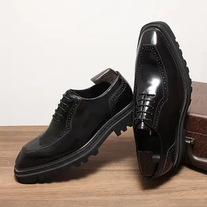 Detailed side and top view of glossy black leather brogue shoes with thick lug soles.