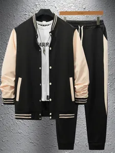Detailed view of men's black and cream varsity jacket and matching jogger pants set