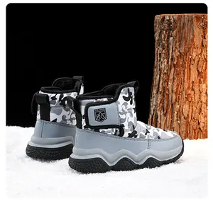 Detailed view of children's thick plush lined winter snow boots featuring gray camo pattern