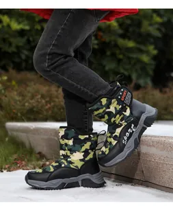 Child wearing camouflage snow boots for winter outdoor activities, warm and durable
