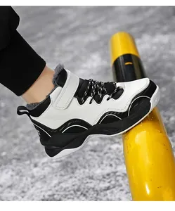 Side view of boy's warm winter basketball shoes with fleece lining and velcro strap