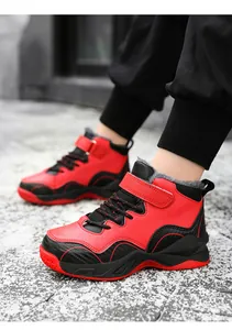 Red and black boys' high-top winter basketball shoes with warm fur lining shown on feet