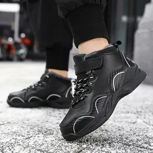 Durable black fleece-lined winter sports boots for boys with velcro and laces.