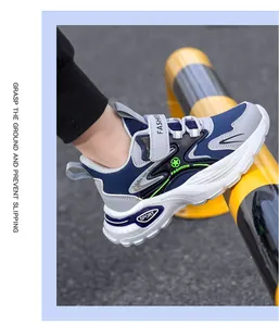 Detailed side view of boys' blue anti-slip athletic sneakers with soft thick soles