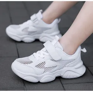 Detailed side view of breathable white children's running shoes featuring mesh panels
