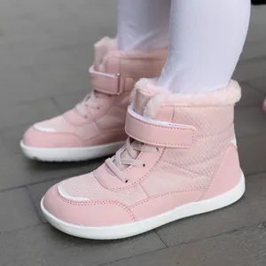 Pink children's winter snow boots with warm faux fur lining and durable velcro strap