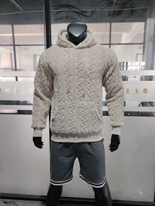 Detailed view of men's jacquard teddy fleece hoodie showing thick texture and kangaroo pocket