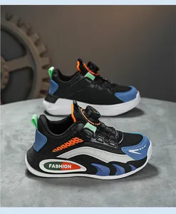 Close-up view of children's mesh sneakers with a quick-adjust rotary buckle system.