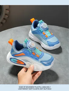 Detailed view of children's sports shoes featuring a rotary buckle and anti-slip sole