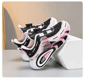 Detailed view of pink and black kids' winter sneakers featuring warm plush lining and dial lacing