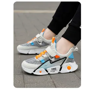 Side view of breathable children's sneakers with mesh upper and velcro strap
