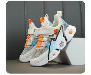 Close-up of breathable mesh sneakers for children with vibrant orange and blue accents.