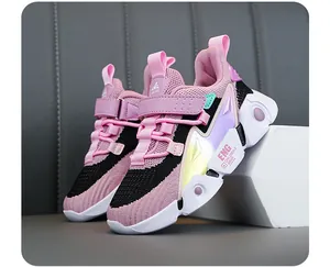 Close-up of pink and black breathable mesh kids' running shoes with lightweight soft soles