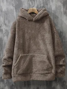 Detail showing the soft teddy fleece texture and kangaroo pocket of the taupe hoodie.
