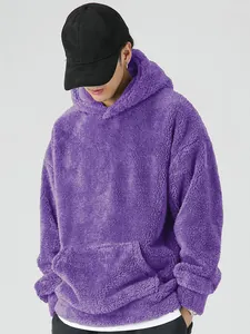 Detail view of purple men's coral fleece hoodie showing plush texture and kangaroo pocket.