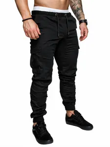 Detailed view of men's black cargo jogger pants with drawstring waist and side pockets