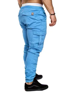 Rear view detail of blue men's cargo joggers with side pockets and elastic cuffs