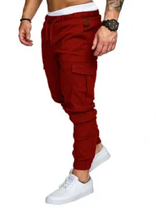 Side view of men's wine red cargo joggers with large utility pockets and drawstring.
