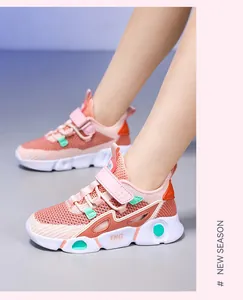 Close-up view of pink breathable mesh sneakers for girls with a secure Velcro strap