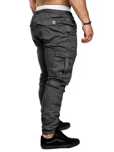 Rear view of dark grey men's cargo jogger pants with functional pockets and cuffs.