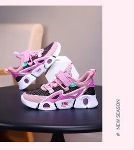 Detailed view of pink girls running shoes featuring breathable mesh and velcro closure