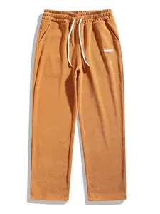 Detailed view of men's vintage mustard corduroy straight-leg casual trousers with drawstring