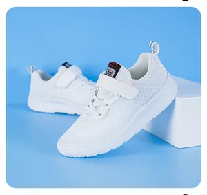 Detailed view of white children's breathable mesh running shoes with strap closure.
