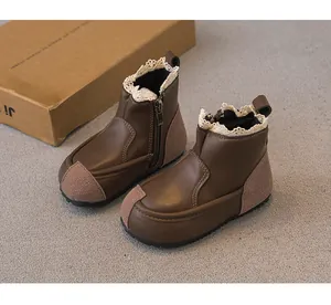 Toddler girl's brown leather boots with elegant lace trim and convenient side zipper