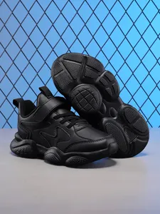 Durable black children's athletic running shoes featuring a thick anti-slip rubber sole