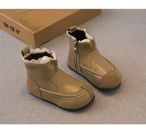 Detailed view of khaki girls' leather boots with lace trim and side zipper closure