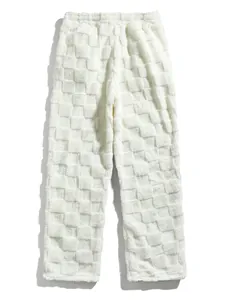 Macro view of white fuzzy fleece checkered men's trousers for autumn and winter.