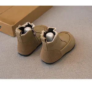 Detailed rear view of girls khaki ankle boots with lace trim and side zipper design