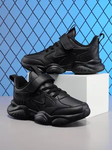 Side view of black breathable children's sports shoes showing sole and strap detail.