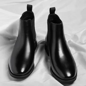 Classic black leather Chelsea boots for men with elastic side panels and heel pull tabs.