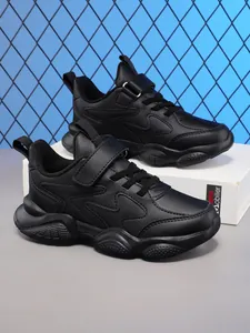 Detail view of black boys' breathable running shoes with durable soft soles