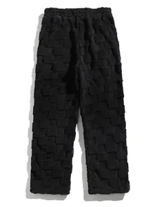 Detail shot showcasing the black checkered fuzzy texture of these casual men's pants