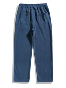 Back view of men's blue corduroy straight-leg casual pants with elastic waist detail