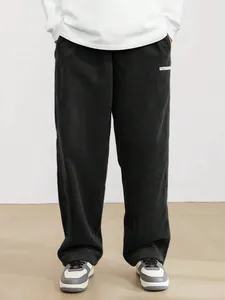 Detailed texture of men's vintage corduroy straight leg streetwear pants