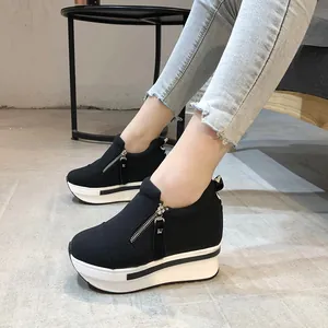 Fashionable women's black canvas shoes with thick white platform sole and side zipper