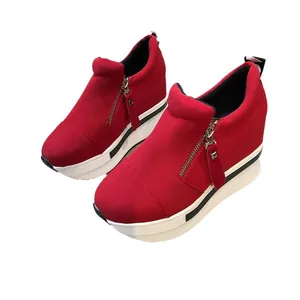 Stylish red women's canvas wedge sneakers with side zipper and thick platform sole.