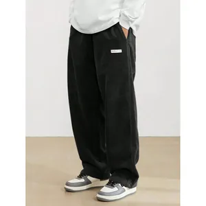 Men's retro black corduroy straight leg pants in trendy high street minimalist style