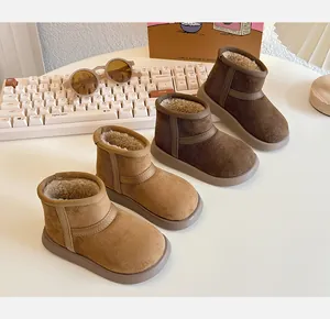 Detailed view of tan and brown children's warm fleece-lined winter snow boots.